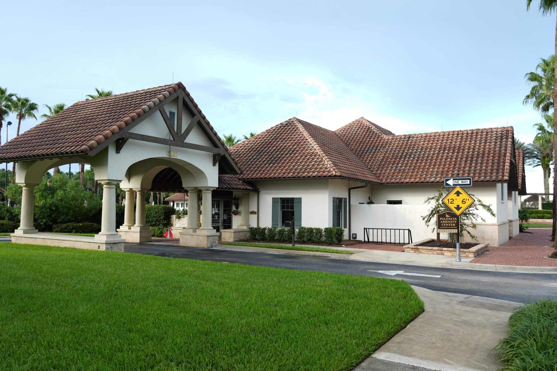Palencia Amenity Center with a covered arched entry drive and tile roof