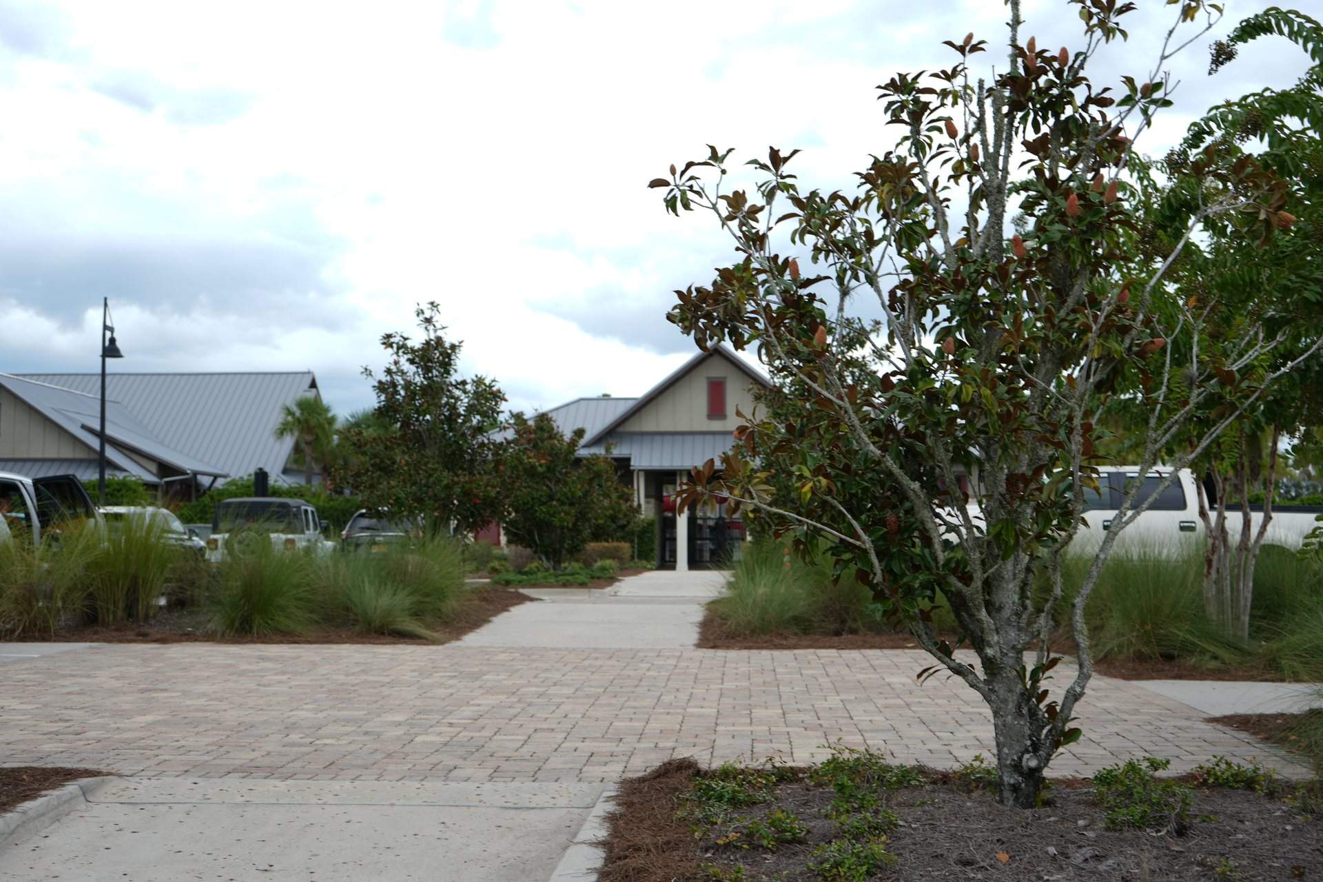 Shearwater amenity buildings with a paver walkway and landscaping