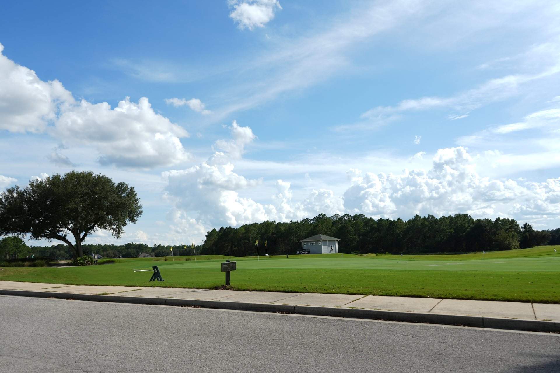 Driving range at the Golf Club at South Hampton under a summer sky