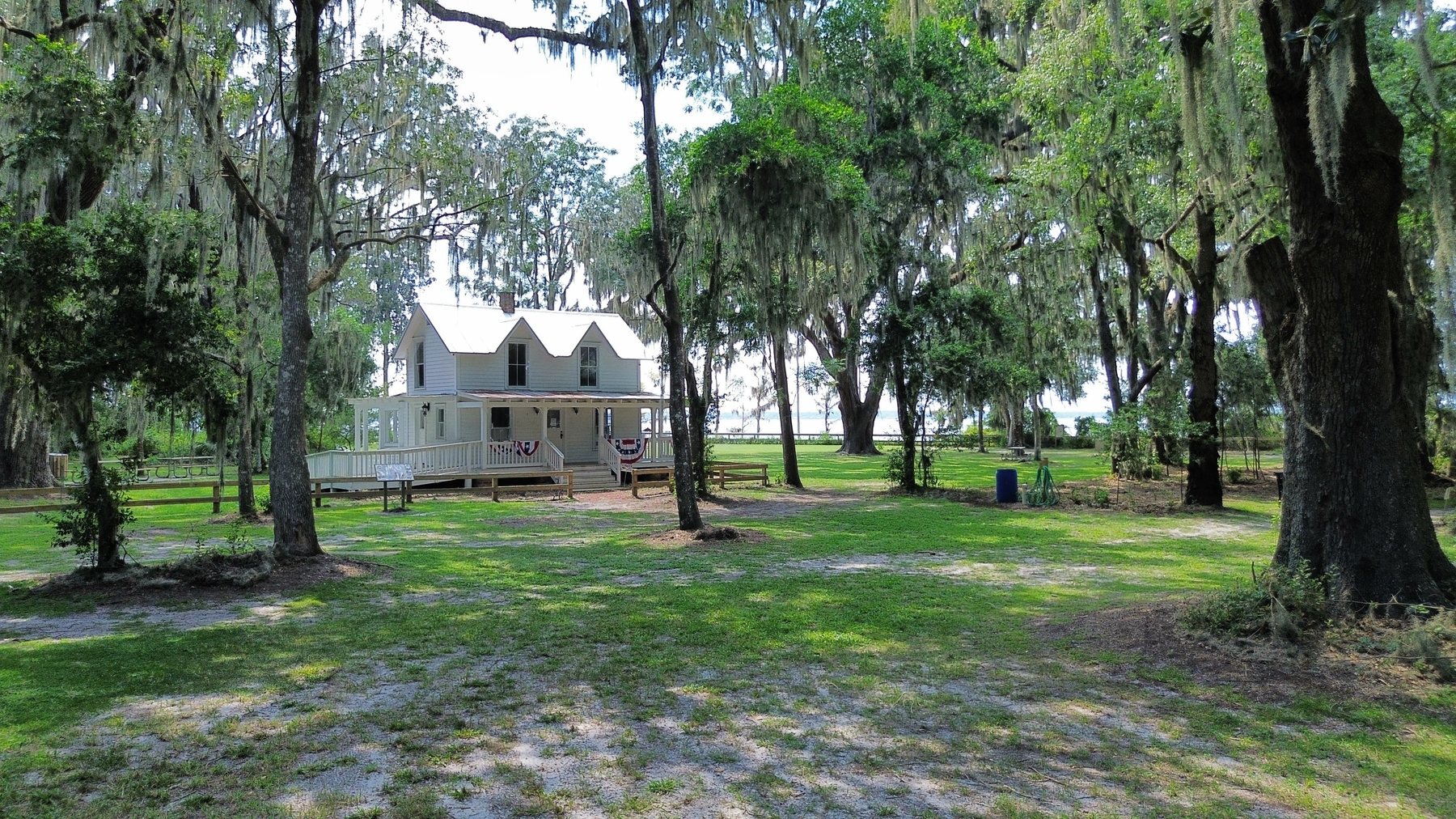 The historic Bennett House at Alpine Groves Park, framed by live oaks, near Julington Creek Plantation